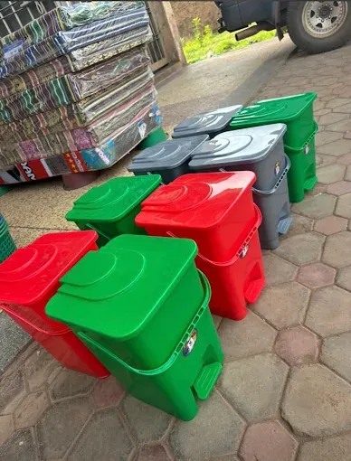 Plastic pedal bins in several colours at Des fair shop, Arua Park, Kampala
